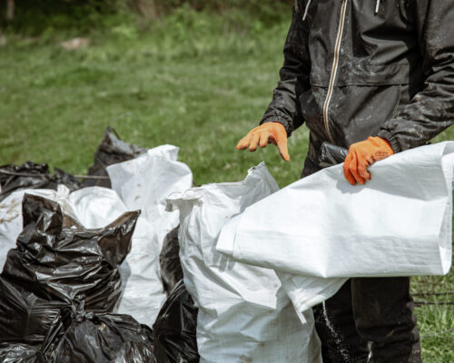 Close up of trash bags filled with trash after cleaning the environment.